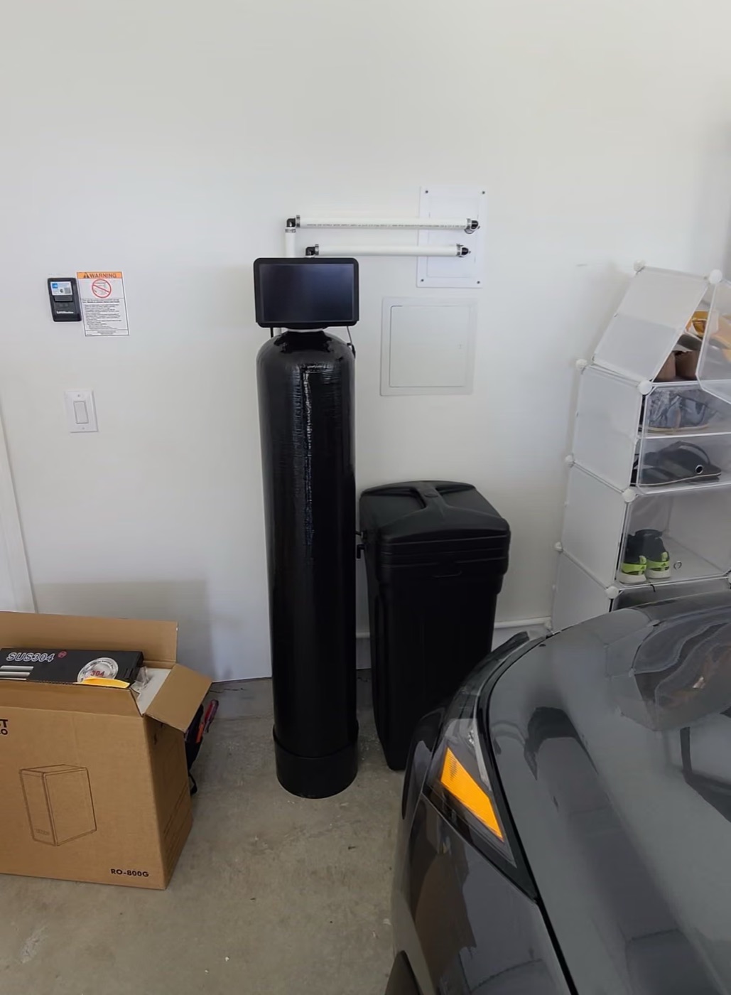 Softener and brine tank with the drain line run to the wall